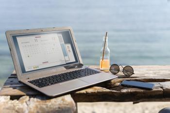arrangement with laptop seaside